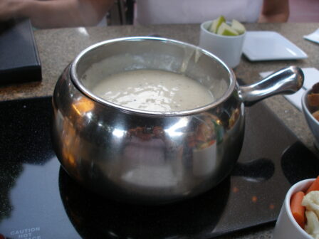 A pot of melting and heating ingredients is the signature item at The Melting Pot. 