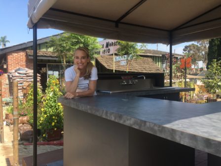 Kim Huffman stands next to the new coffee and pastry staging area for Espresso Mio at Mission Hills Nursery. 