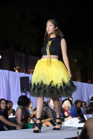 Model is wearing a beautiful yellow and black feathered dress by B.JASH.I, winner of Designer of the Year at FWSD 2015. 