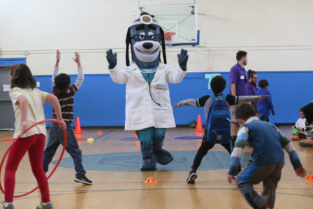 Dr. Health E. Hound offers exercise tips to local students.
