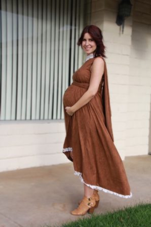 Aubree Lynn showing her baby bump in a dress by Oseas Villatoro.