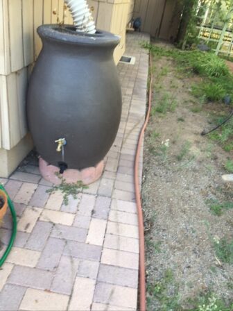 Cisterns posted at each downspout save water for future usage. 