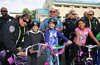 Porter Elementary School students receive new bikes and helmets.