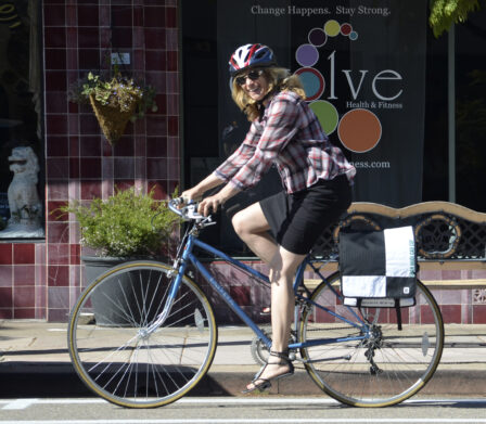 Judi Tentor rides a vintage Mixtie blue bicycle.